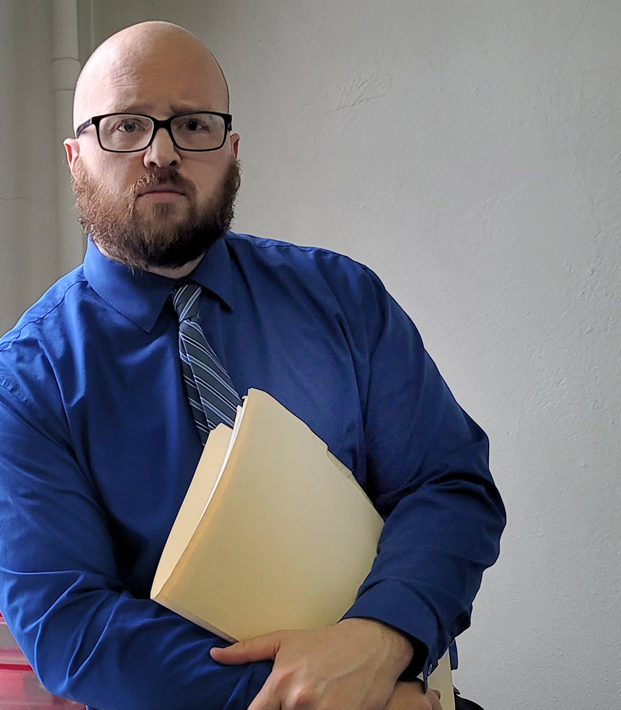 Attorney Joe Sutton with files