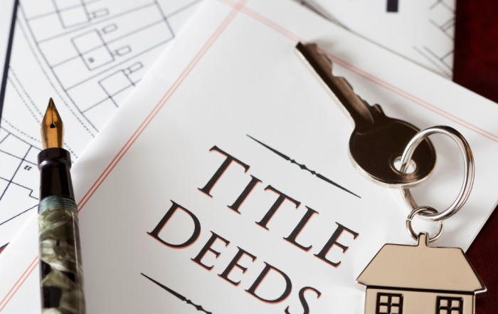 Attorney handing signed deed to client in a Pennsylvania law office