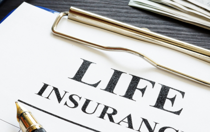 Life insurance policy document with pen and clipboard, symbolizing claim denial or financial benefits.